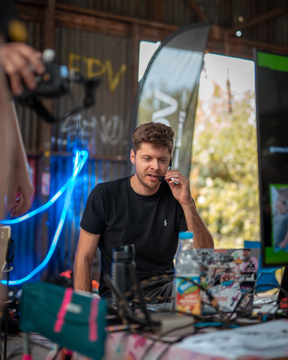 Dejf Václavík hosting an FPV freestyle jam with a headset microphone