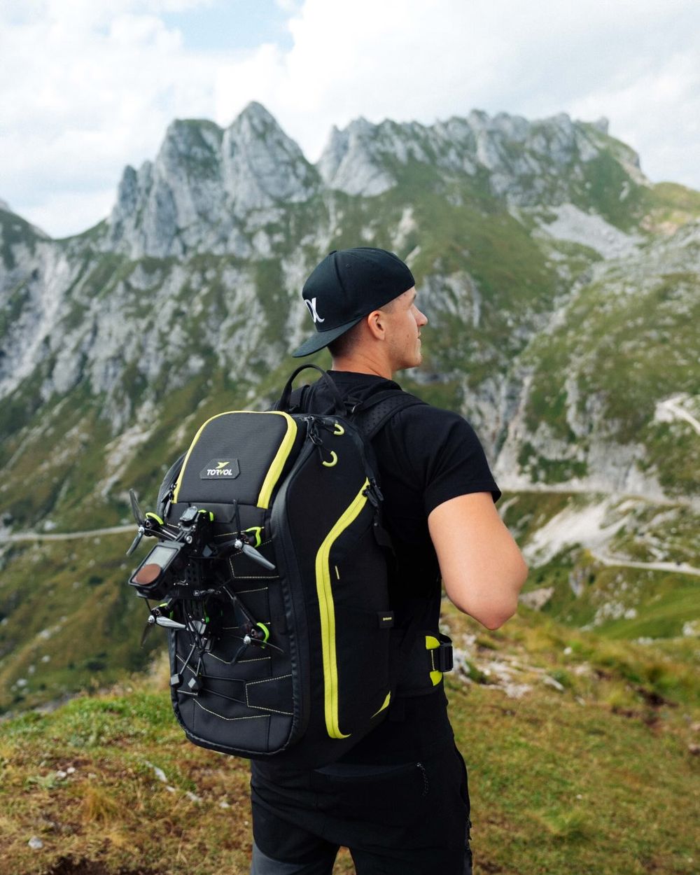 Marek Hošta with a 5-inch FPV drone on a Torvol backpack in the mountains