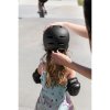 RKD159JR REKD Junior Elite 2.0 Helmet Black Putting On 1