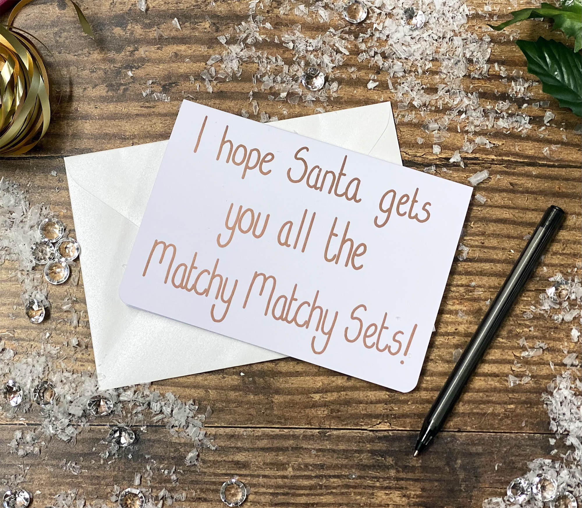 Vánoční přáníčko 'I hope Santa gets you all the Matchy Matchy Sets!' od Emily Cole