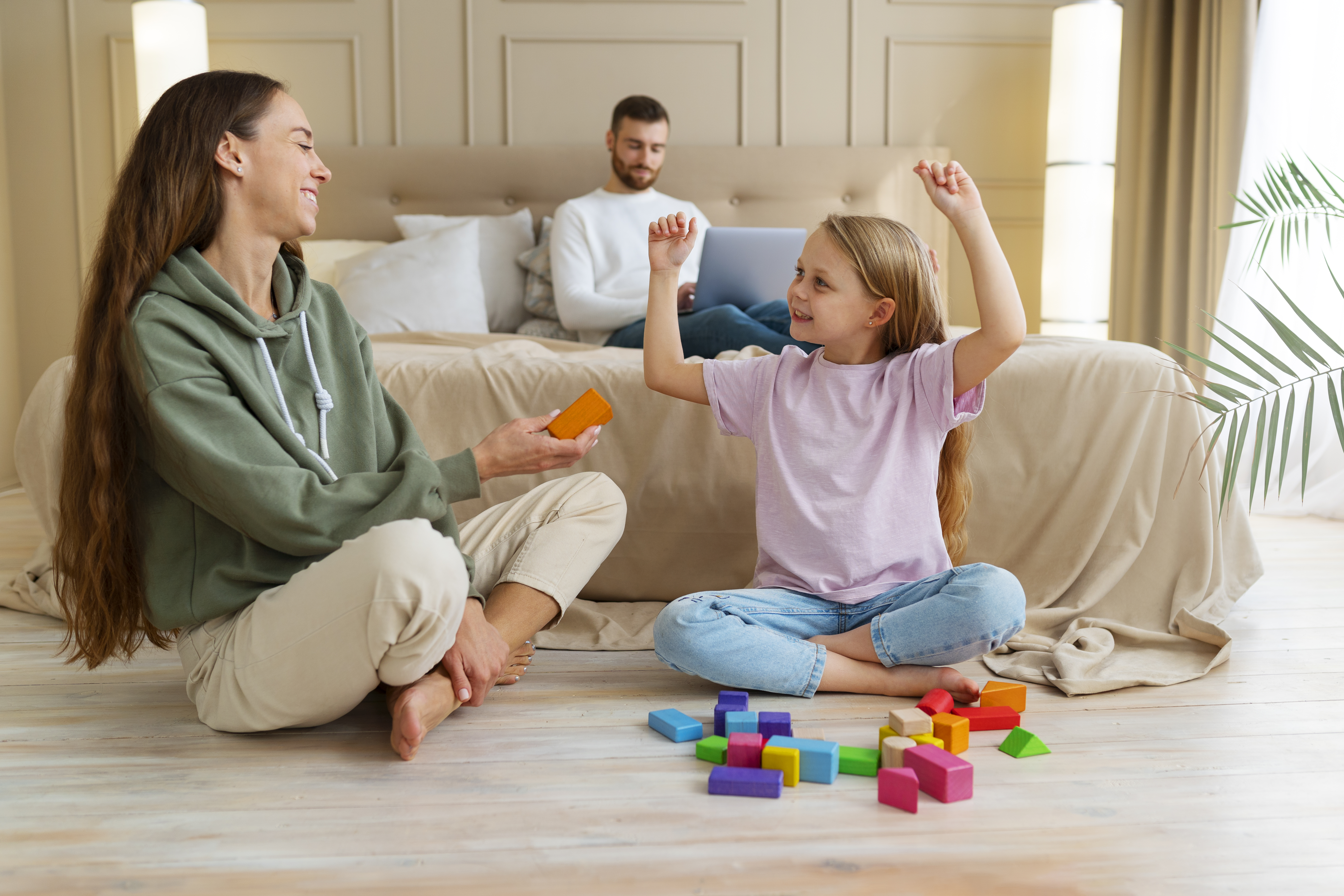 full-shot-parents-working-remotely