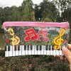 Taštička s klaviaturou a houslovým klíčem - plastová