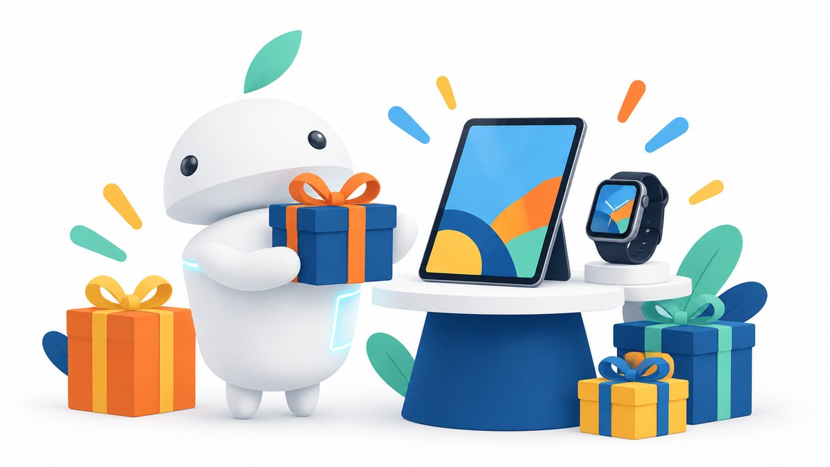 Darček pre mamu z elektroniky — maskot iguru.sk s darčekom, tabletom a smart hodinkami