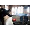 A young man playing pool on a Shelby Pool Table