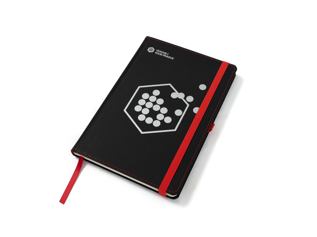 Black notebook with red rubber band