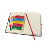 Black notebook with red rubber band