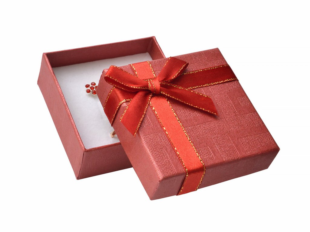 Červená papierová krabička s mašľou so zlatým okrajom na malú sadu