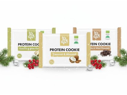 Three protein cookie packages from subject 1 arranged on a white background with subtle Christmas (1)