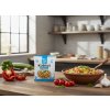 Create another nice image in a kitchen setting with the vegetable couscous package from subject 1