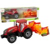 Červený traktor s kultivátorem a třecím pohonem