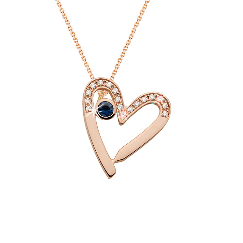 Zlatý přívěsek ve tvaru srdce s modrým safírem a diamanty