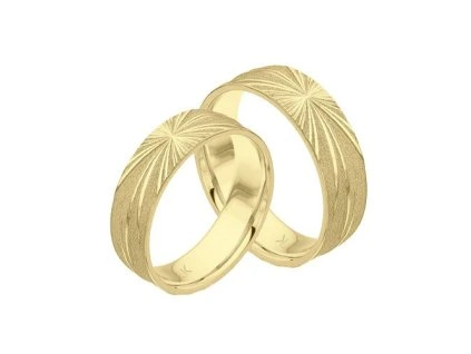 Zlaté snubní prsteny paprsky