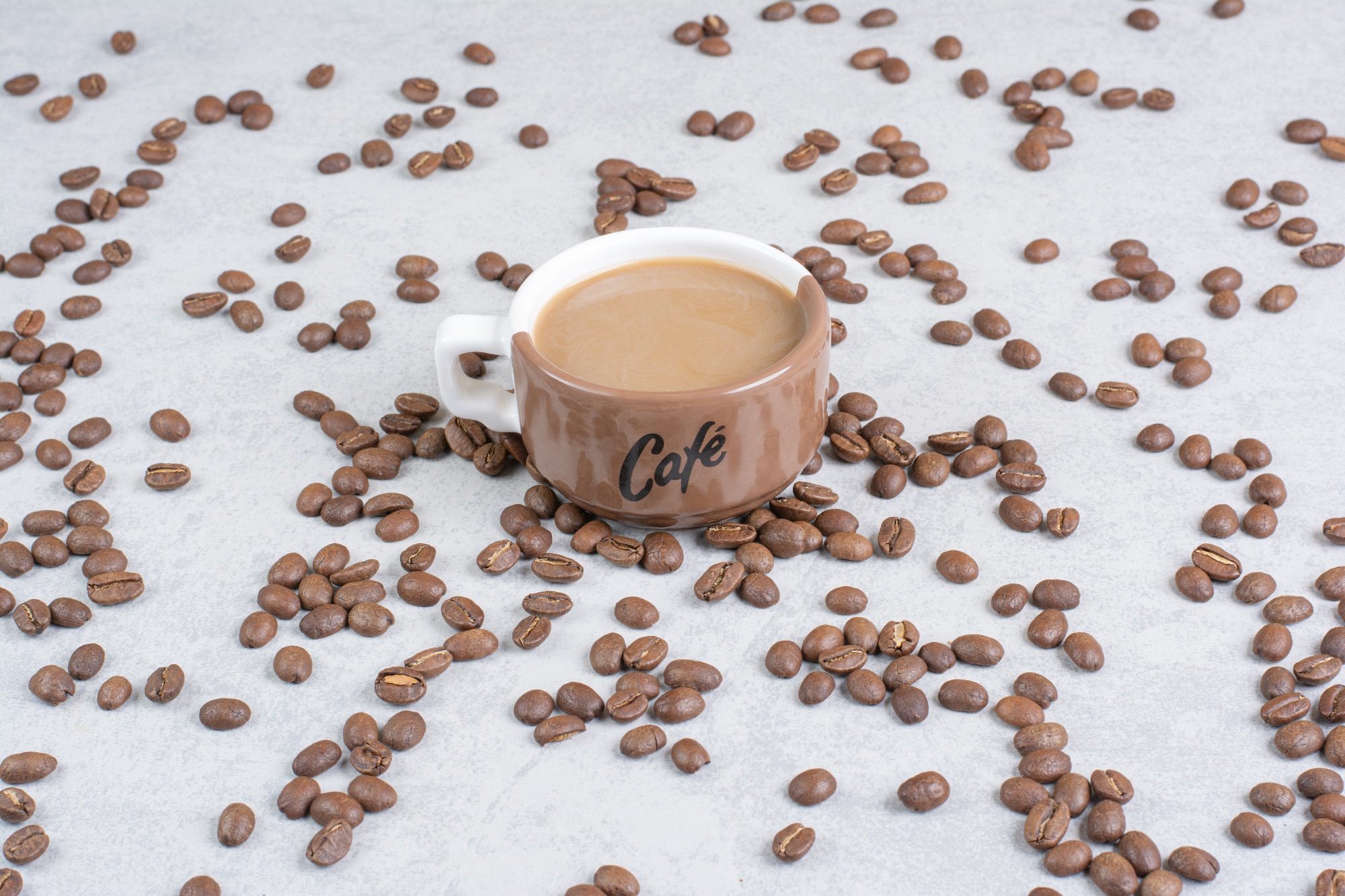 cup-of-coffee-and-coffee-beans-on-marble-backgroun