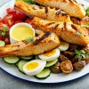 2928 3 grilled salmon nicoise salad with fresh vegetables 2025 03 13 11 10 29 utc