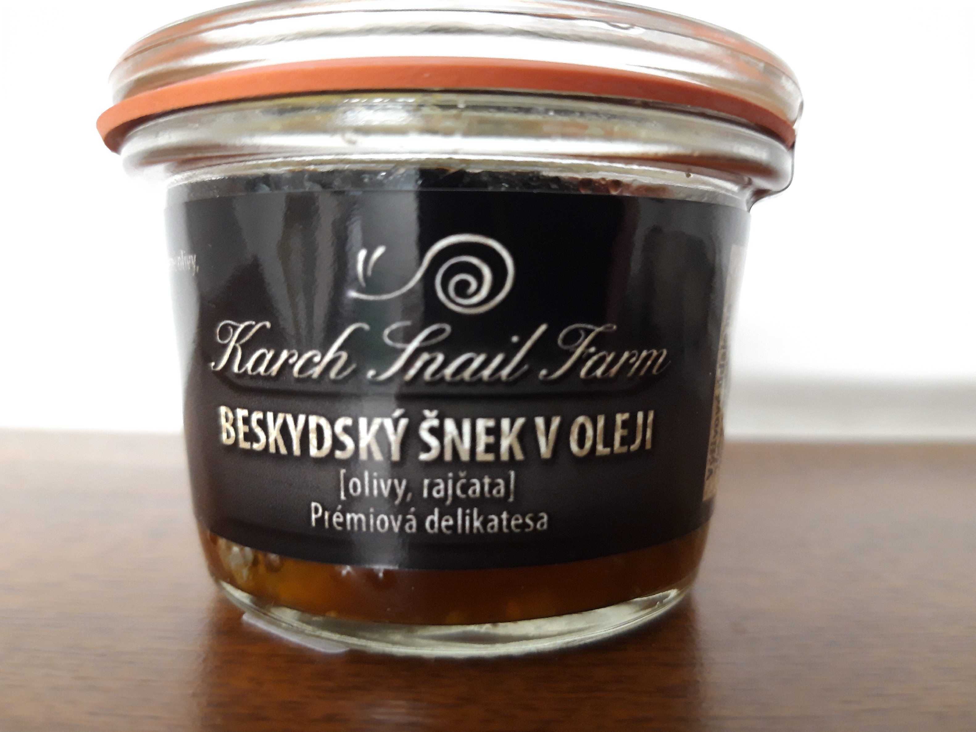 Beskydský šnek v oleji (Olivy, rajčata), 75g