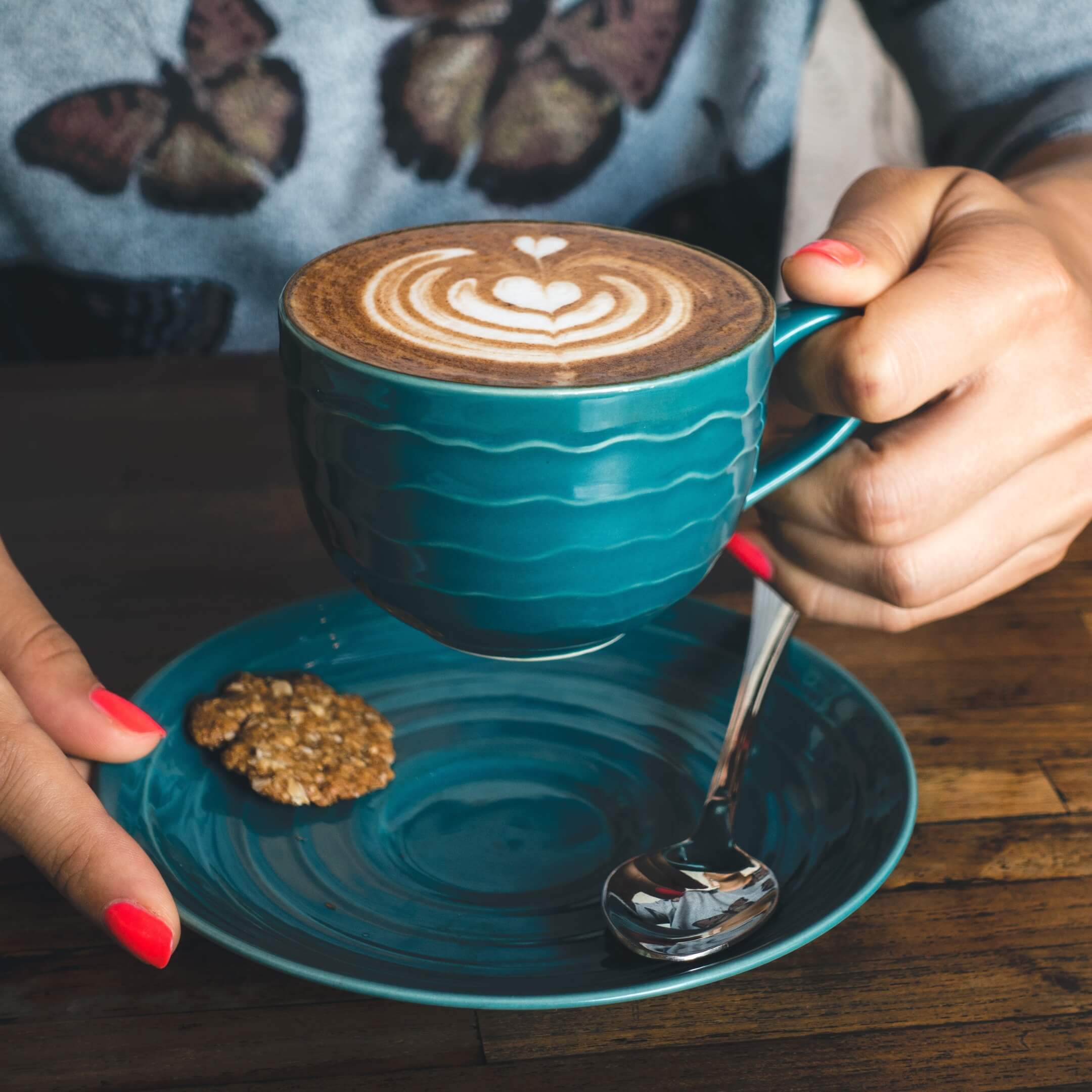 Pouring coffee into a cup