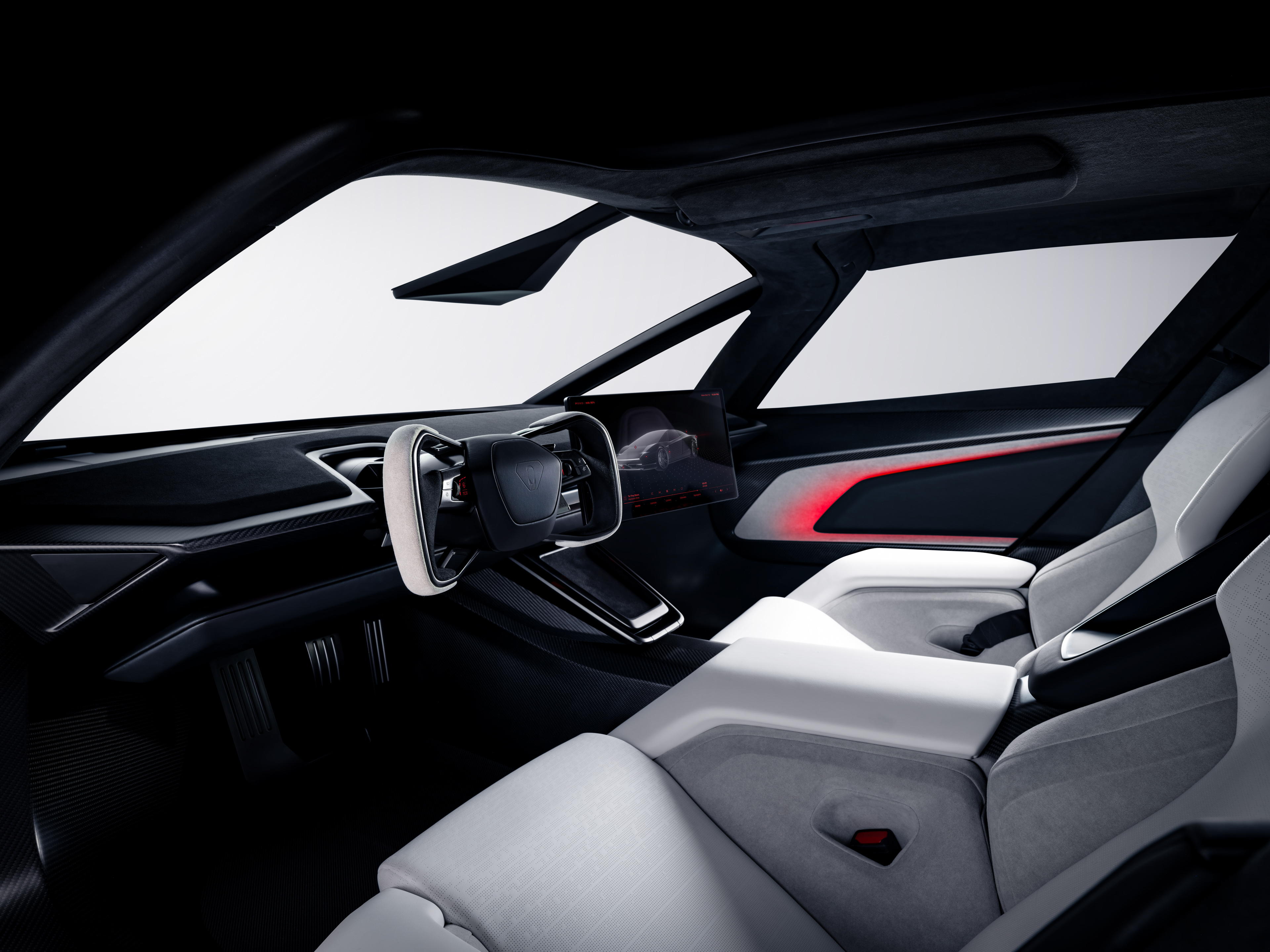 Interiér Tesla Roadster 2026 – volant yoke, centrálny displej a športové sedadlá