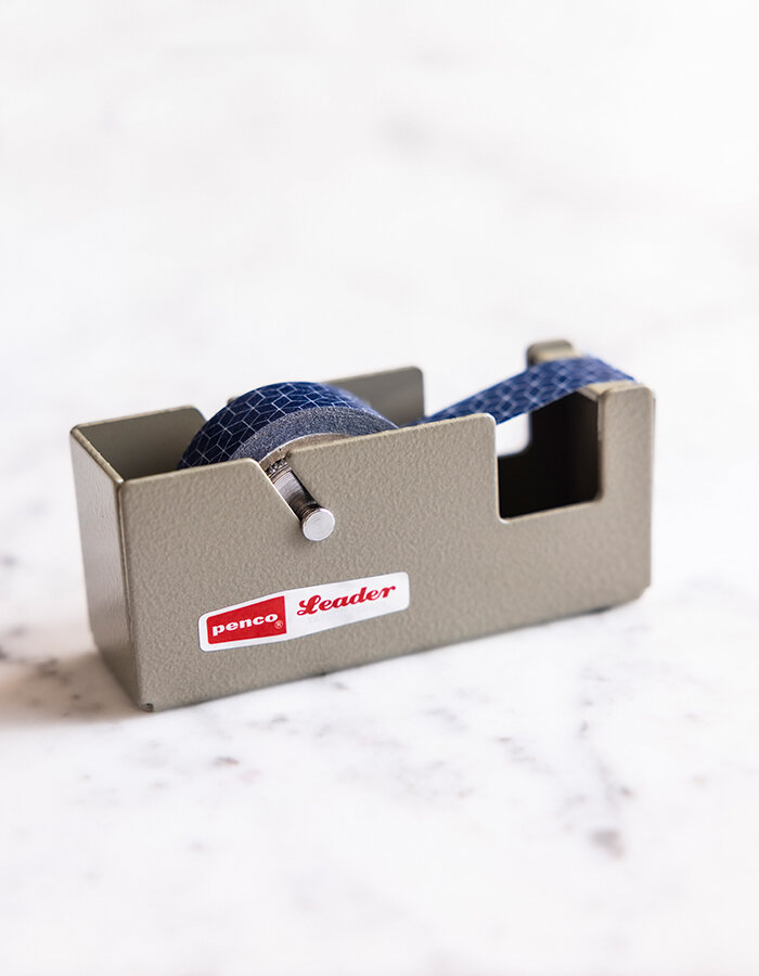 Small steel tape dispenser in ivory