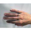 Women's black ring Implicate ring