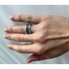 Unisex silver ring with band of gems