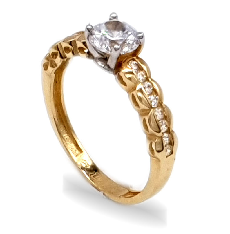 Zlatý zásnubní prsten posetý zirkony