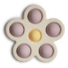 Mushie Silikónová hračka Pop-it Flower - Soft lilac pale / Daffodil ivory