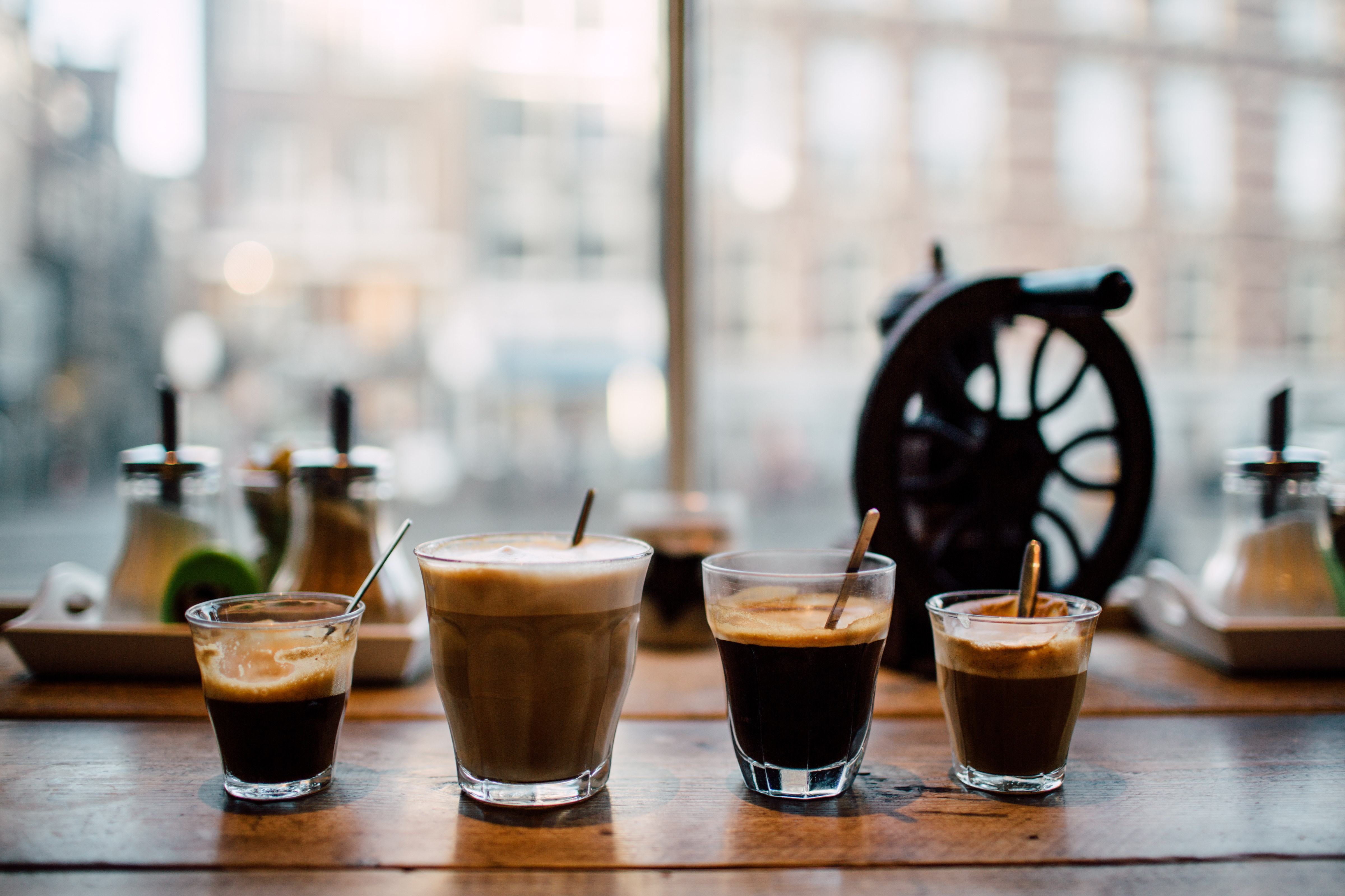 coffee-drinks-on-wooden-table-by-window-2026-01-05-01-14-27-utc