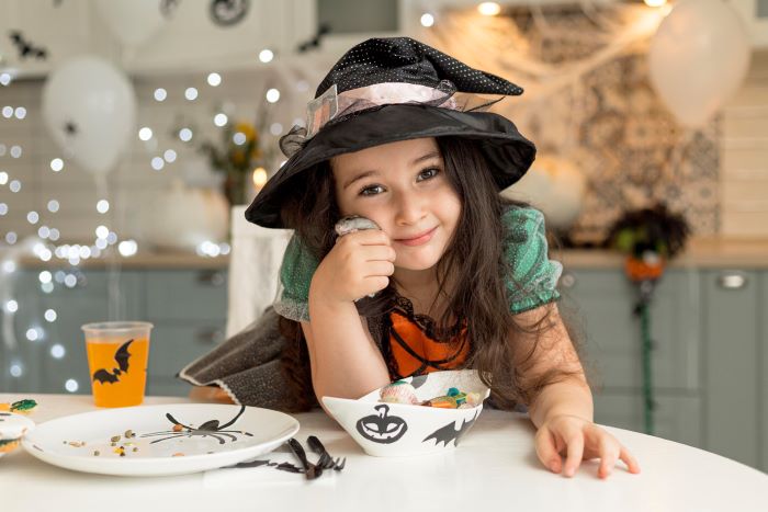 front-view-cute-little-girl-with-witch-costume