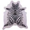 Platzset aus weißem Kuhfell mit Zebramuster