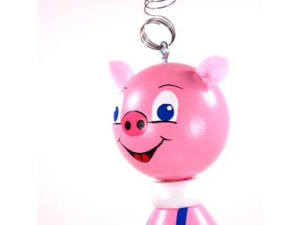 piggy wooden figure on spring