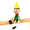 pinocchio wooden sitting figure