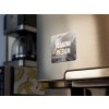 fridge magnet mockup with a coffee machine and bananas print in the back a14789 (2)