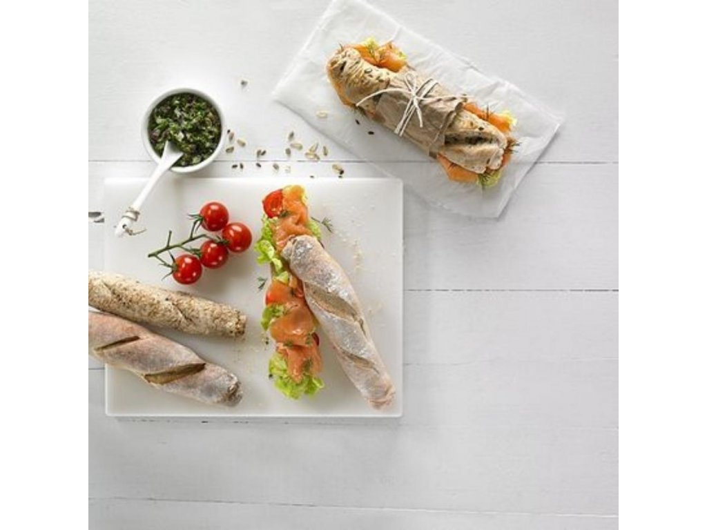 Three Baguettes On A White Plate On A Light Background. Stock