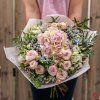 Summer bouquet of pink hydrangea and cluster roses