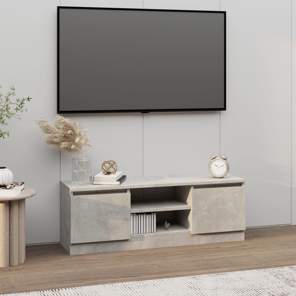 vidaXL TV skrinka s dvierkami betónová sivá 102x30x36 cm