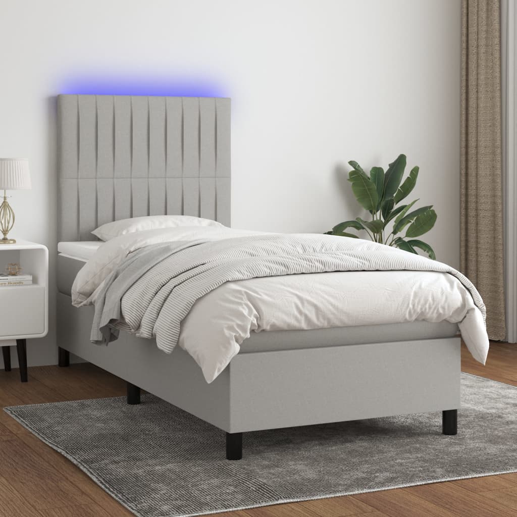 vidaXL Posteľ boxsping s matracom a LED bledosivá 90x200 cm látka