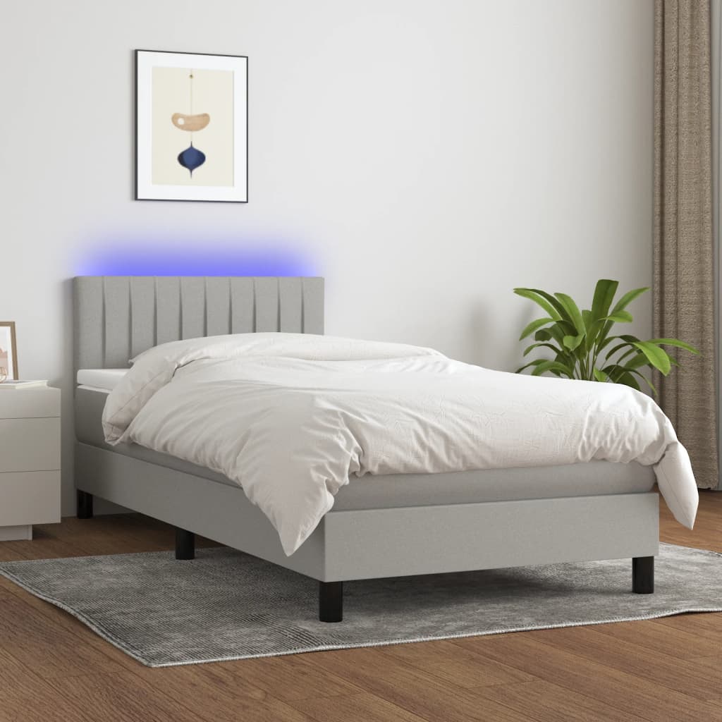 vidaXL Posteľ boxsping s matracom a LED bledosivá 90x190 cm látka