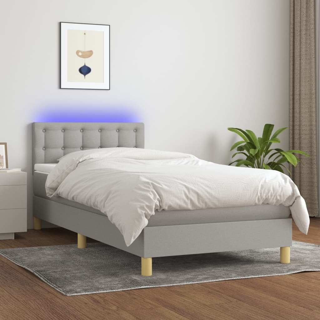 vidaXL Posteľ boxsping s matracom a LED bledosivá 90x200 cm látka