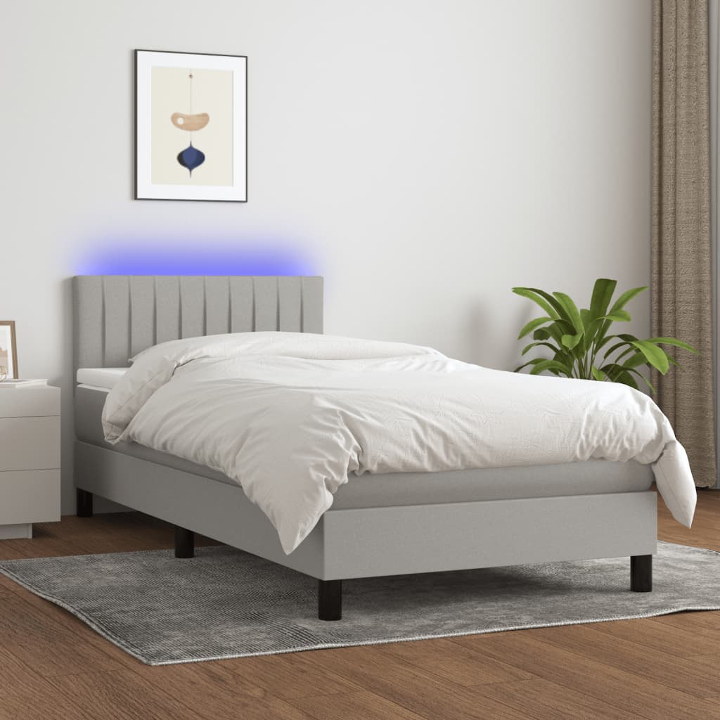 vidaXL Posteľ boxsping s matracom a LED bledosivá 90x200 cm látka