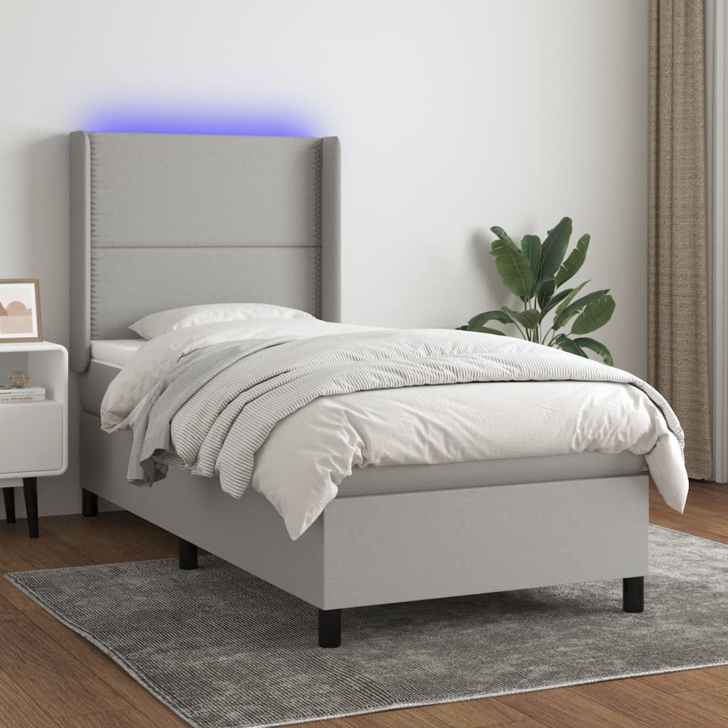 vidaXL Posteľ boxsping s matracom a LED bledosivá 90x190 cm látka