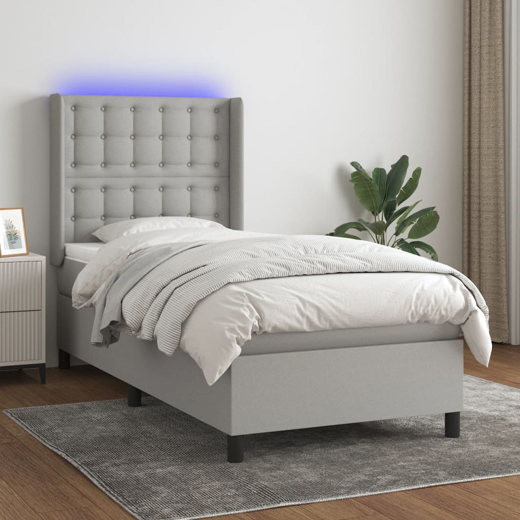vidaXL Posteľ boxsping s matracom a LED bledosivá 90x190 cm látka