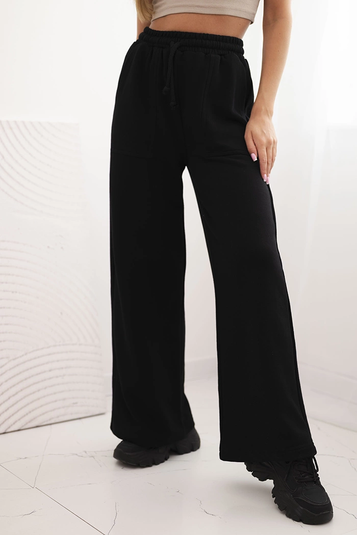 Kesi Dámské tepláky s kapsami a řetízkem Barva: Černá, Velikost: UNI