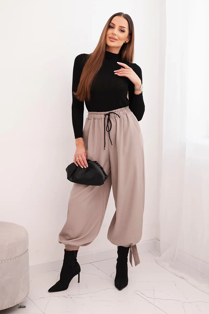 Kesi Dámské kalhoty 90495 s širokými nohavicemi a zavazováním na spodku Barva: Béžová, Velikost: UNI