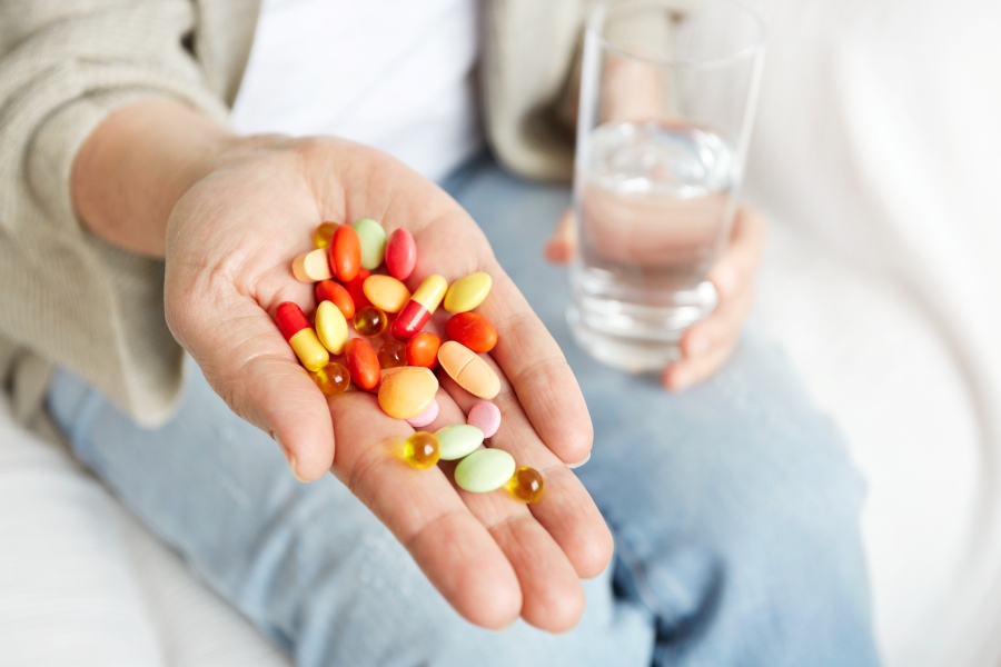 pills-tablets-vitamins-drugs-heap-mature-hands