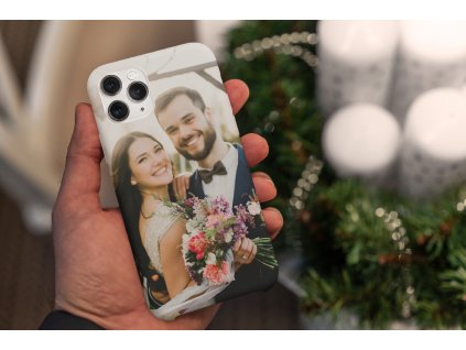 christmas themed mockup of a man holding a phone case 5173 el1 2