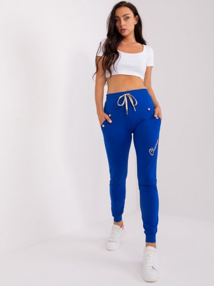 Modré tepláky s nápisem a kapsami