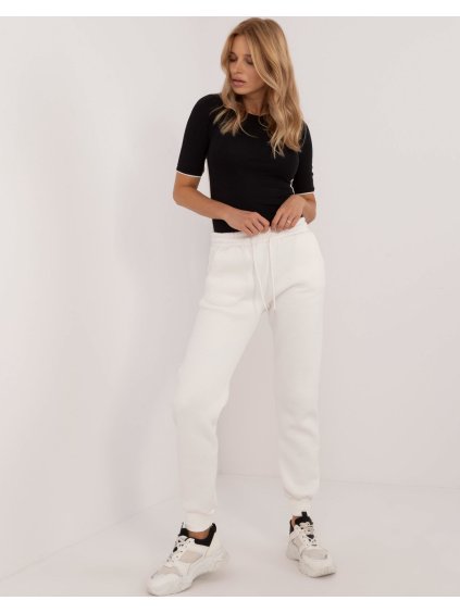 Smetanové dámské tepláky s kapsami