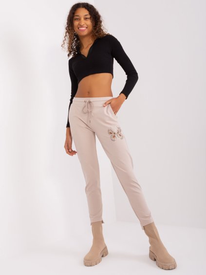 Világos bézs melegítőnadrág pillangó mintával