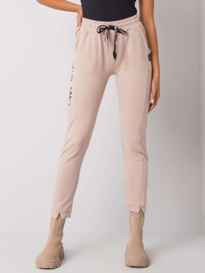 Béžové tepláky s nápisom na boku