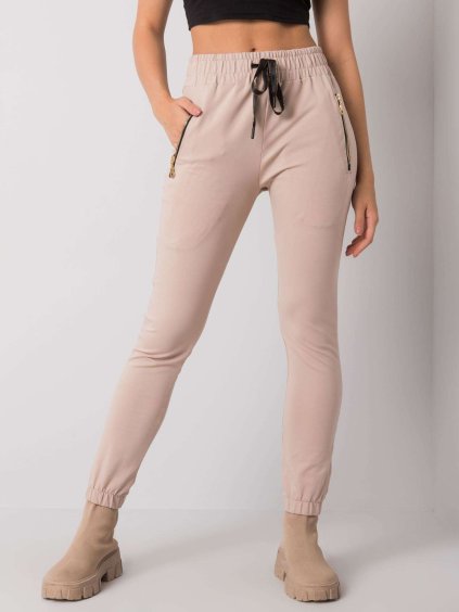 Béžové tepláky s vreckami na zips